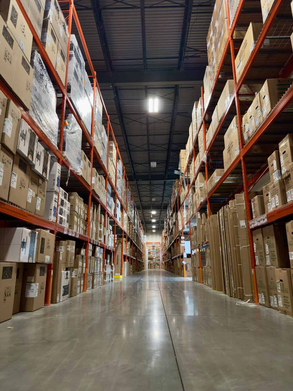 Busy Milwaukee distribution aisle illustrating warehouse and manufacturing leadership hiring